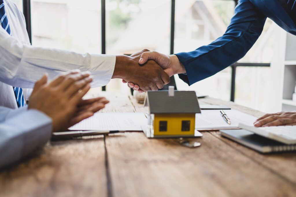 Handshake over real estate contract